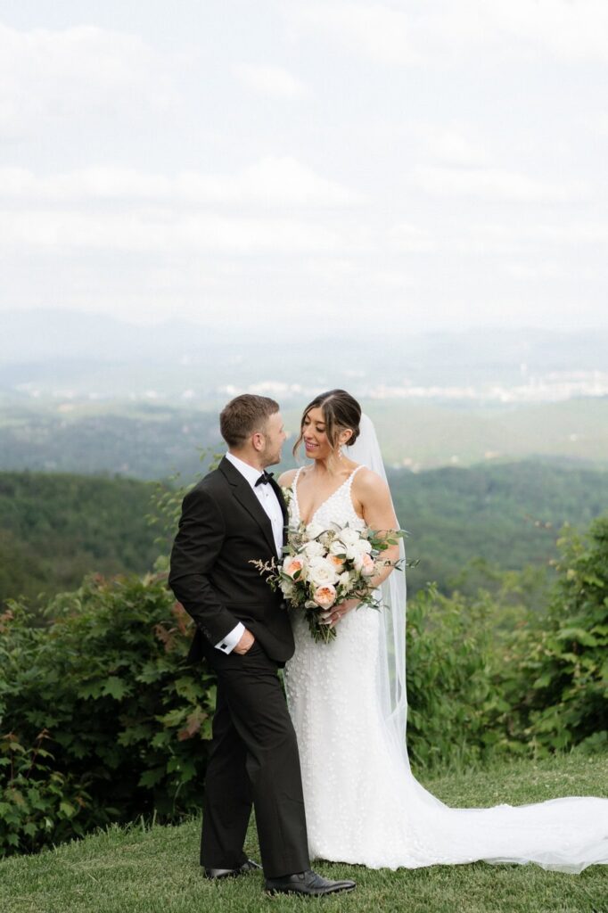 couple sharing a sweet moment overlooking the great smoky mountains
