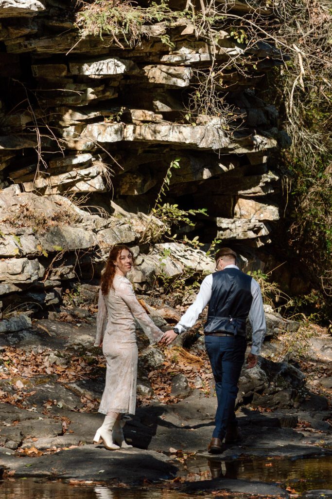 couple hiking through the mountains at tennessee elopement