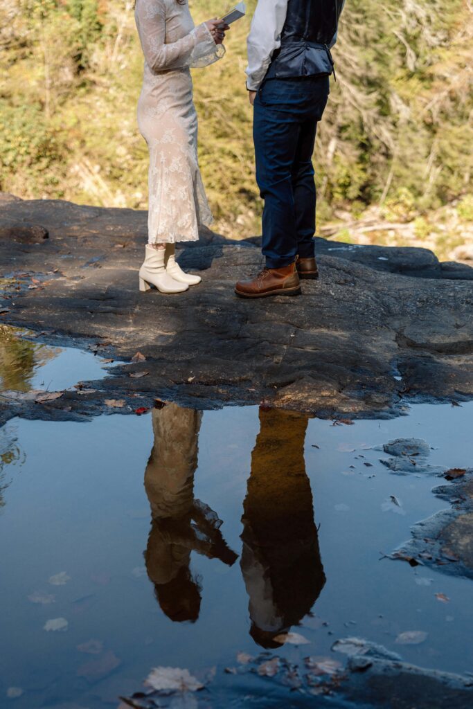 reflection of couple during vow reading at fall creek falls elopement