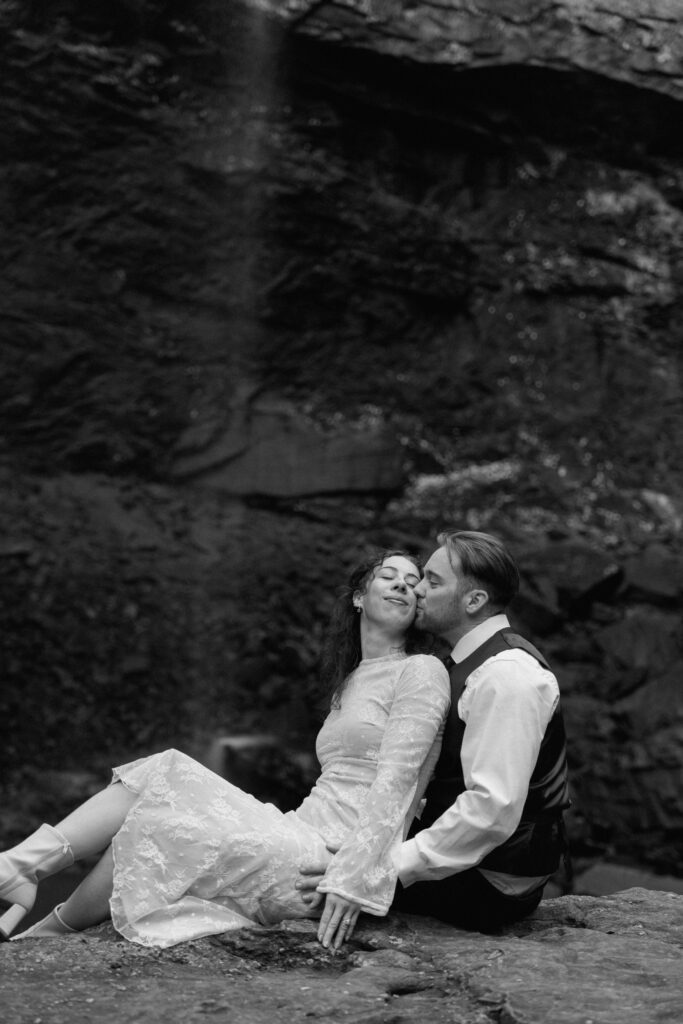 groom kissing the bride on the cheek at their tennessee elopement