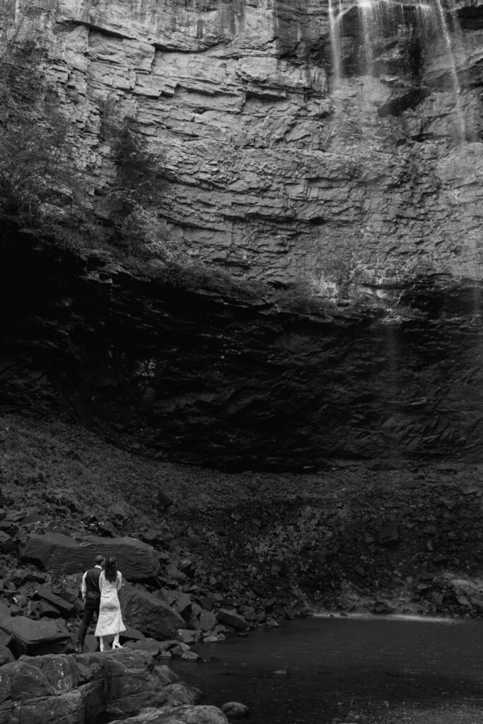 couple admiring the waterfall at their tennessee elopement