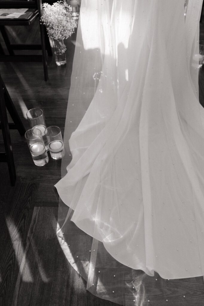 brides dress detail during her first look