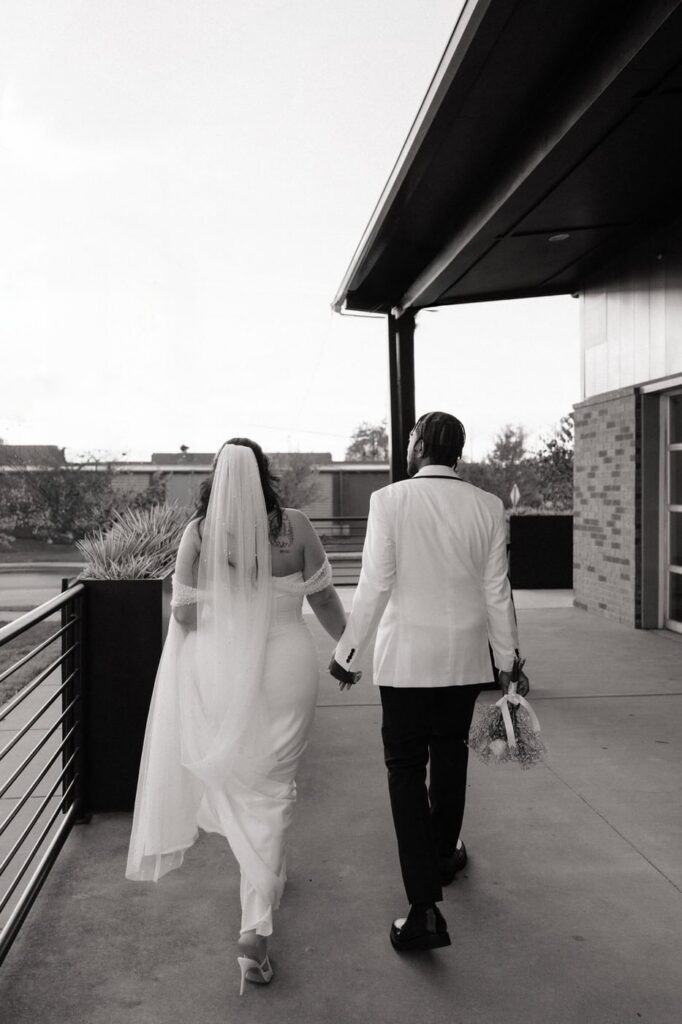 Bride and groom walking at 14Tenn Nashville wedding
