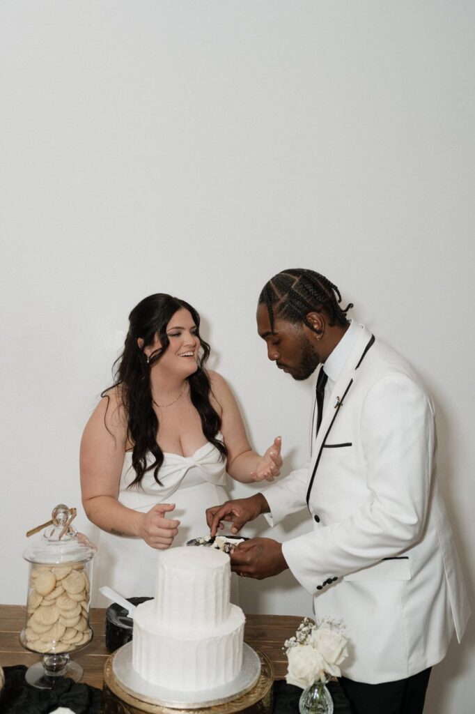 nashville wedding photographer documents cake cutting at reception