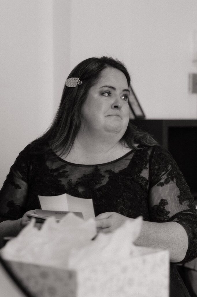 emotional moment at nashville wedding mom of the bride opening a gift