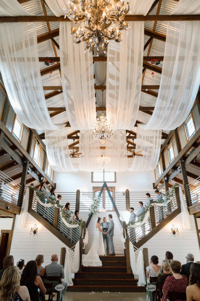 Ceremony on the double staircase at Fiddle Dee Farms Tennessee