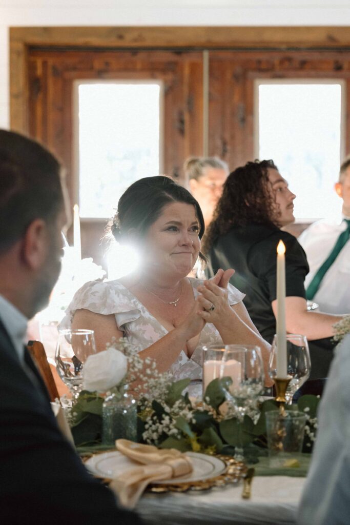emotional moment of mother of the bride during toasts at wedding reception