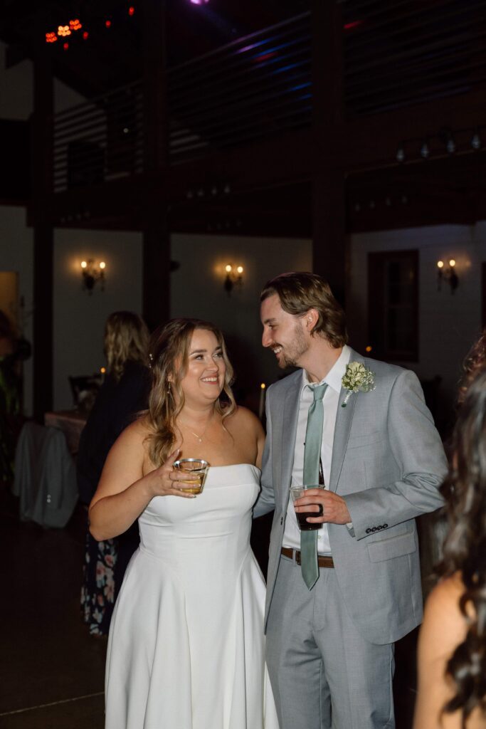 bride and groom laughing on the dance floor at nashville wedding reception