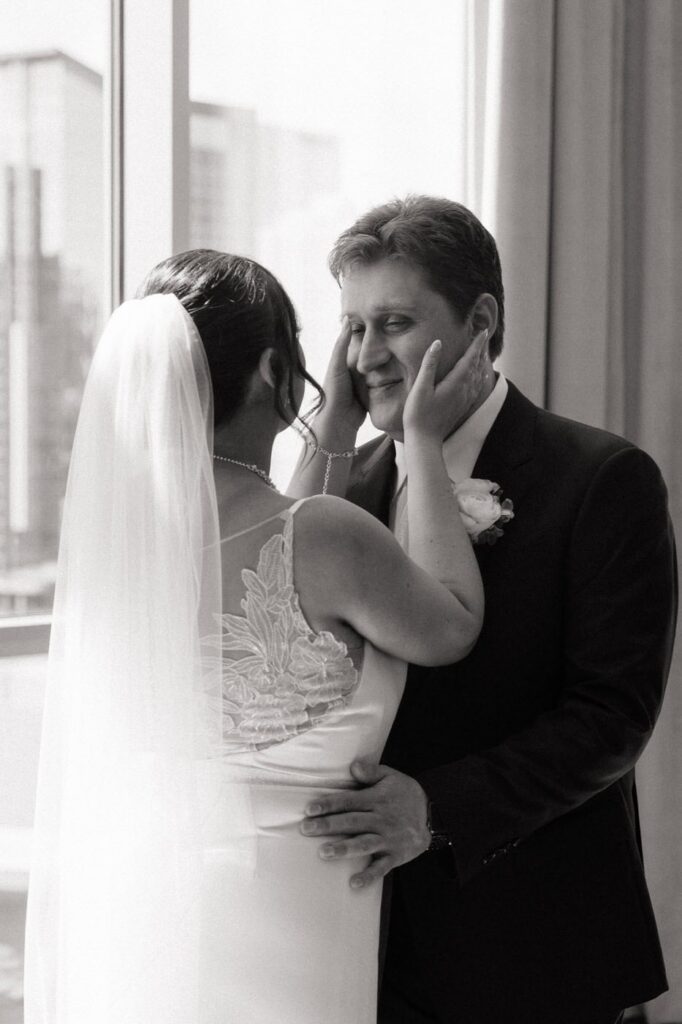 couple sharing a candid moment after their first look