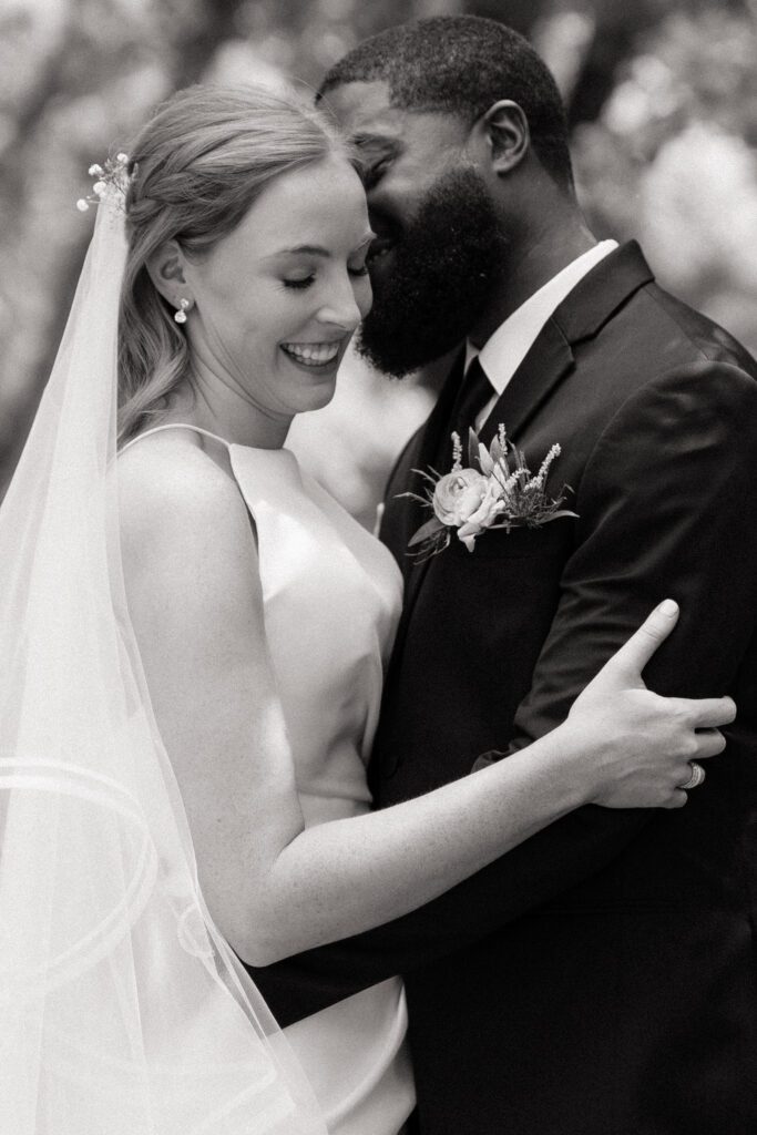 candid moment of bride and groom laughing on wedding day in nashville