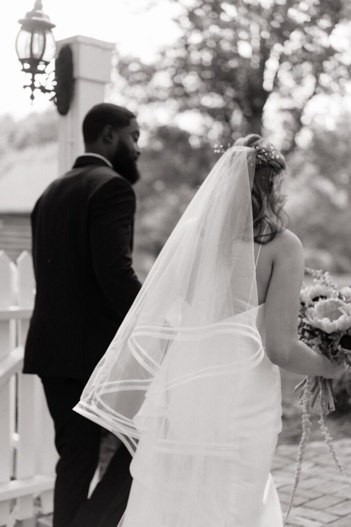 candid moment of couple walking on their wedding day