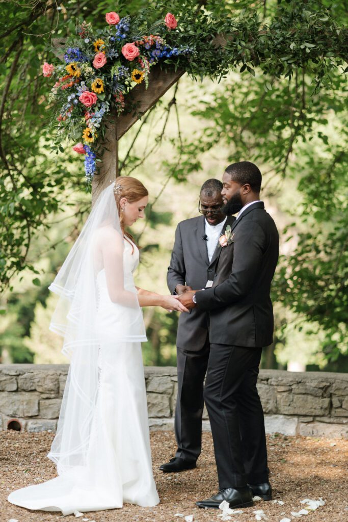 couple exchanging vows at nashville wedding venue