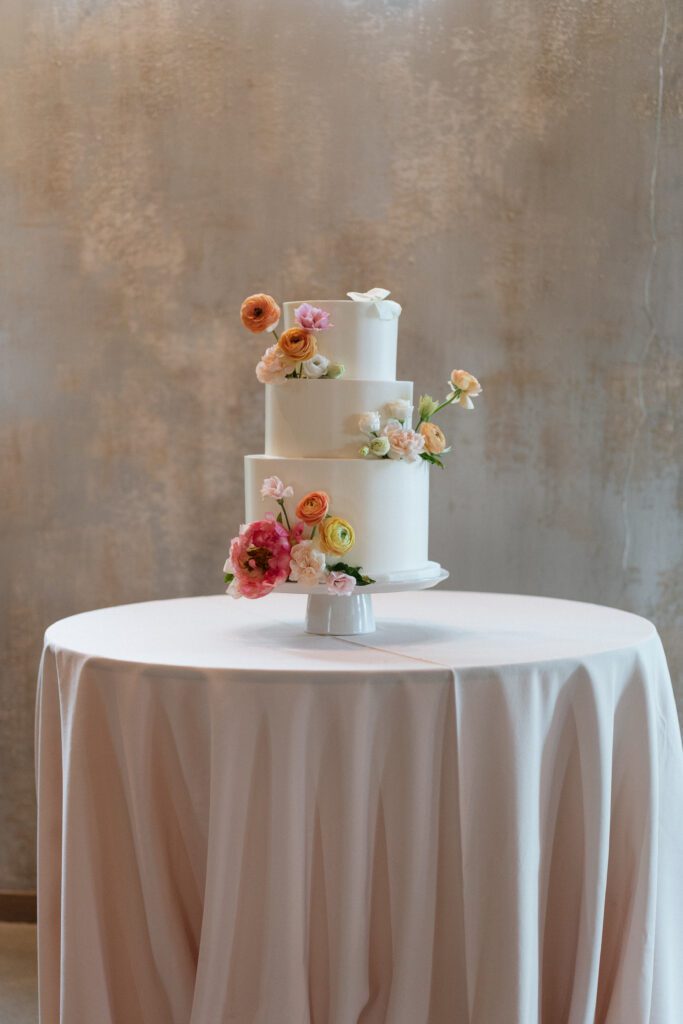 summer flowers on a wedding cake in nashville