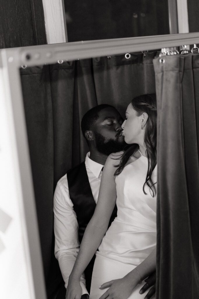 couple in the photobooth at their wedding reception in nashville