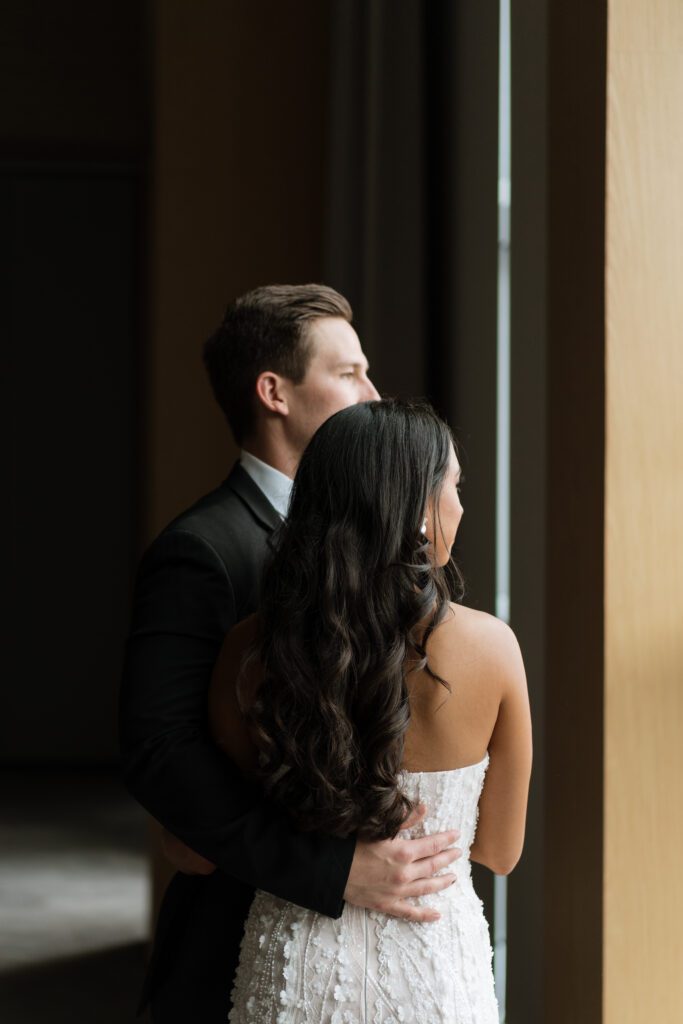 candid moment between couple on their wedding day at the country music hall of fame