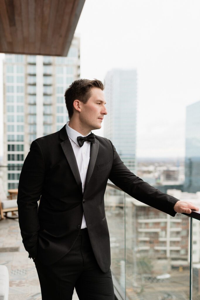 groom overlooking the nashville skyline on his wedding day