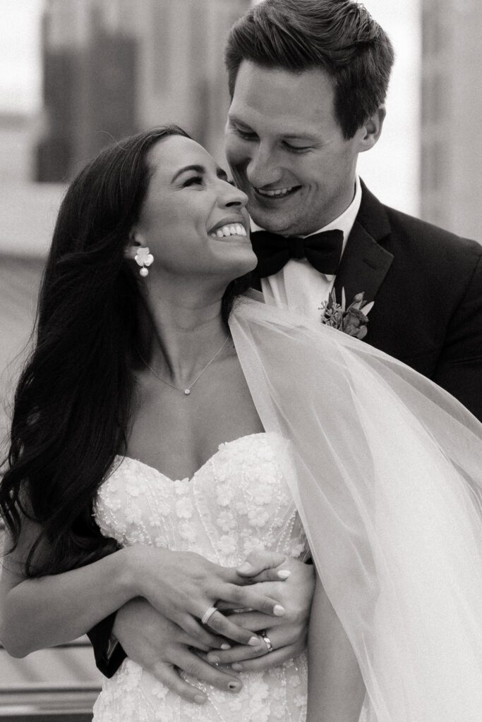 black and white image of couple embracing at country music hall of fame wedding
