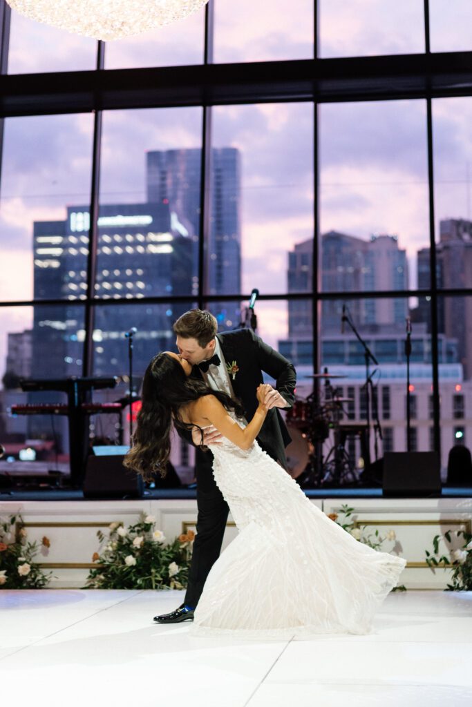 first dance between bride and groom on wedding day in front of nashville skyline
