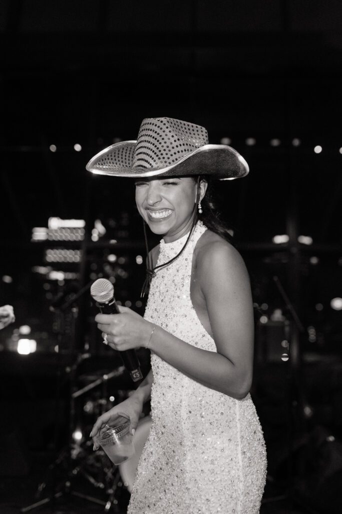 candid photo of bride on stage at her wedding in nashville