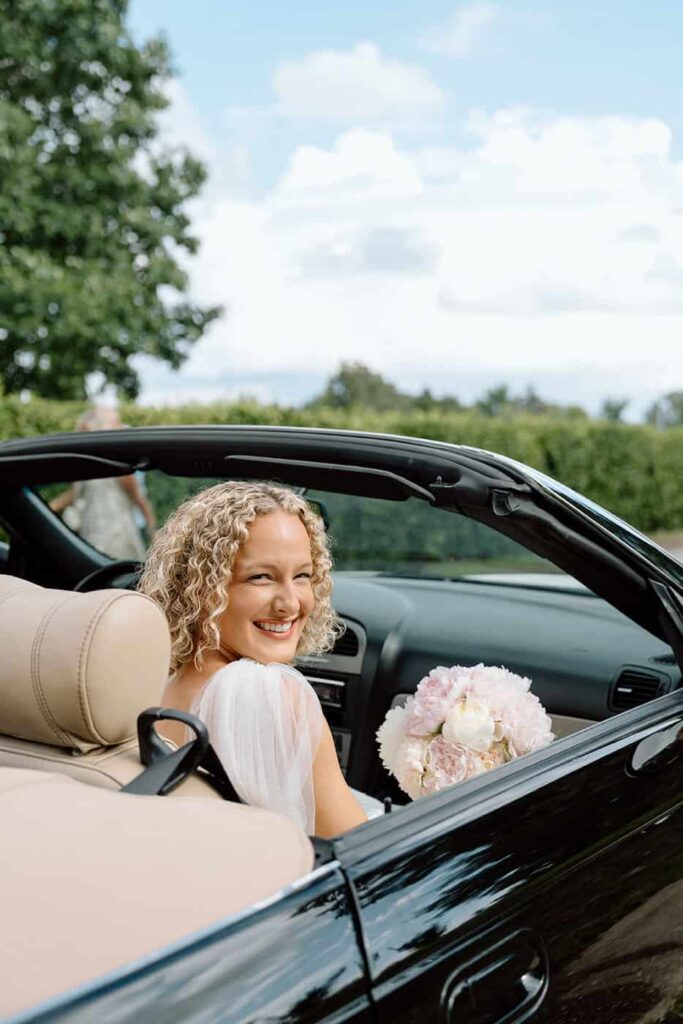 bride in thunderbird car before ceremony in tennessee