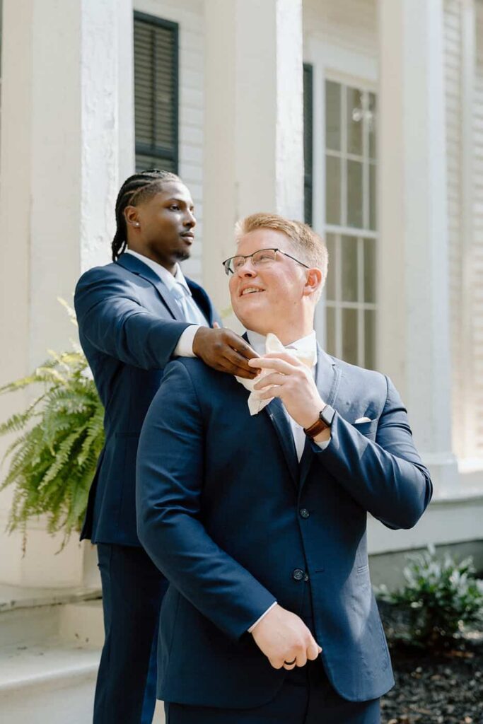 candid moment of groom waiting for his bride