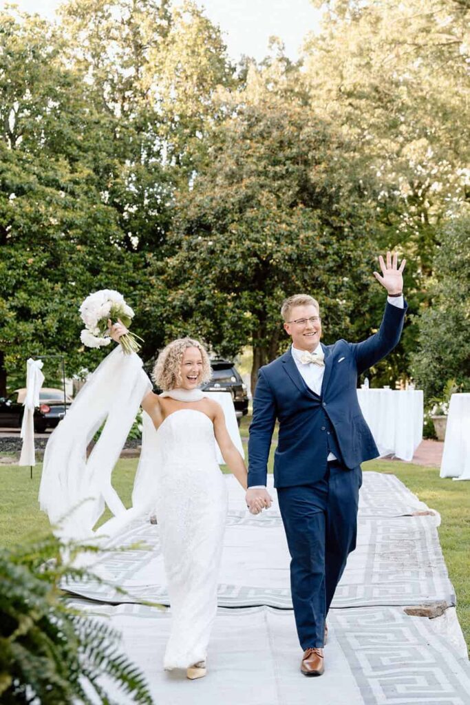 couple making their grand entrance to the wedding reception