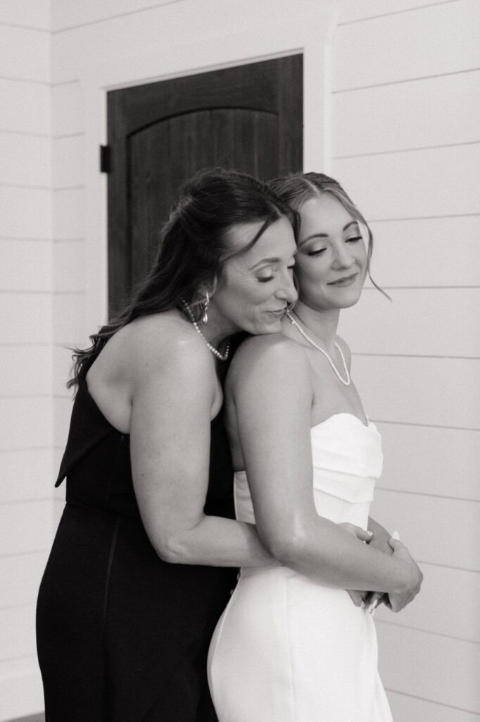 bride and mom sharing a sweet moment on wedding day in tennessee