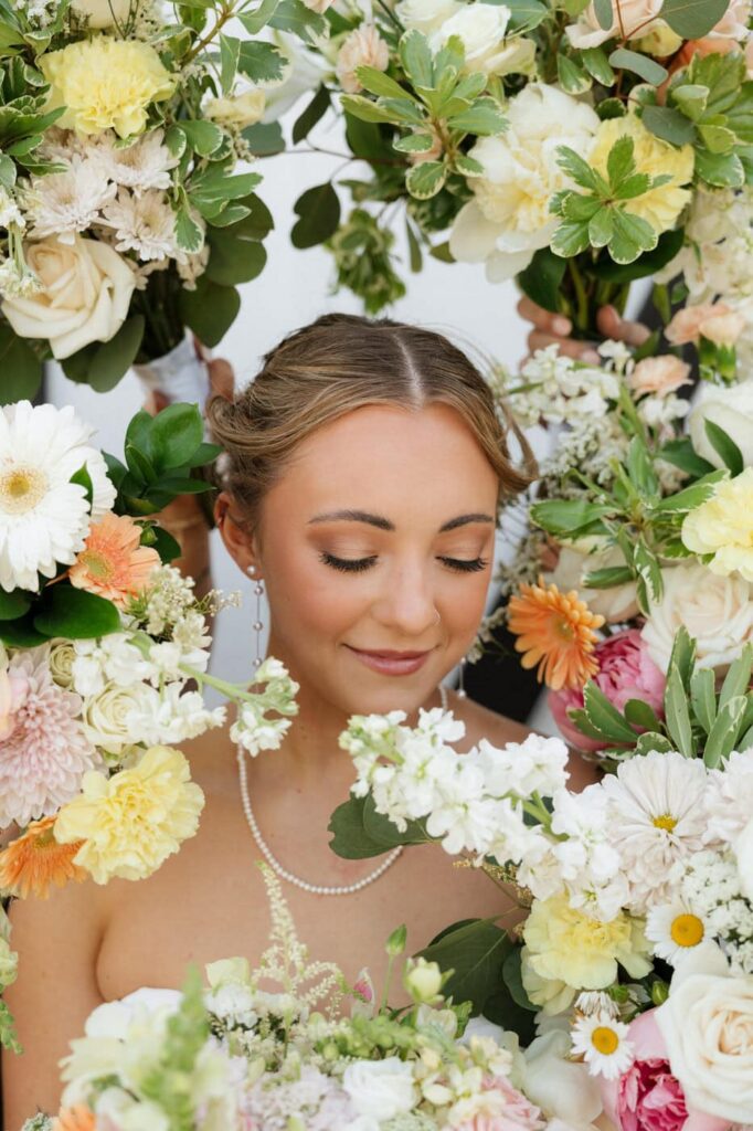 bride surrounded by spring florals