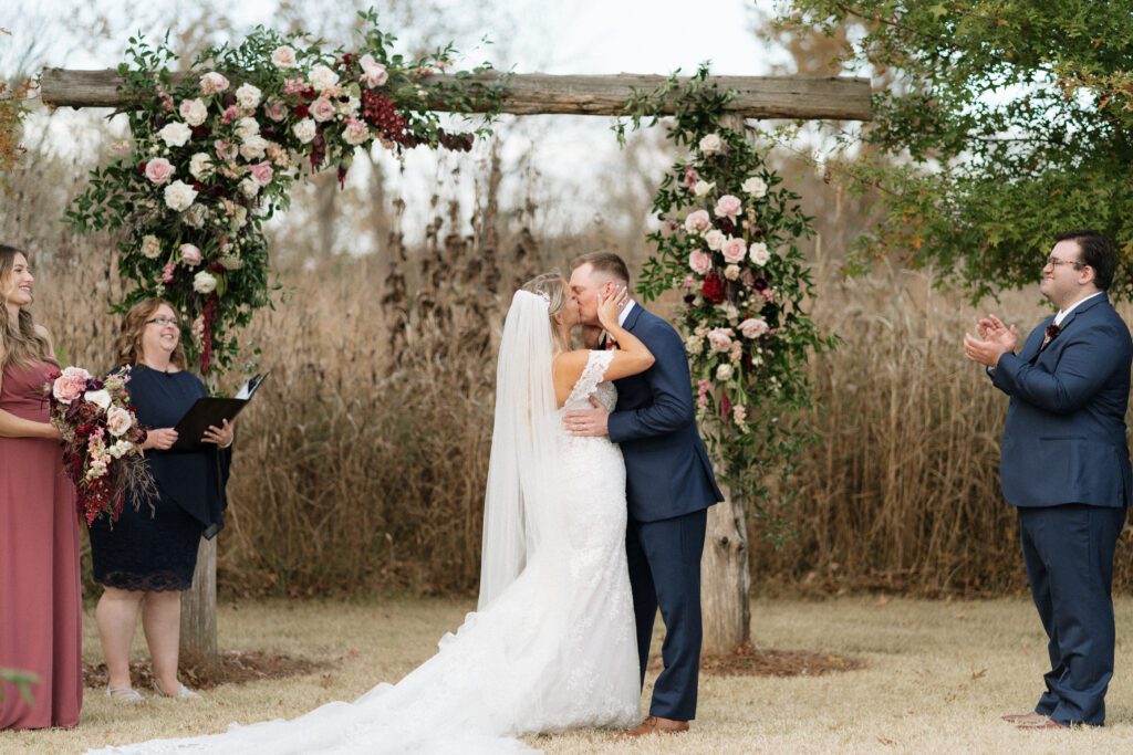 first kiss at long hollow gardens wedding ceremony