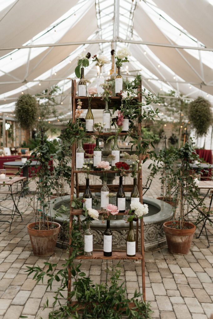 wine bottle seating chart at nashville wedding venue