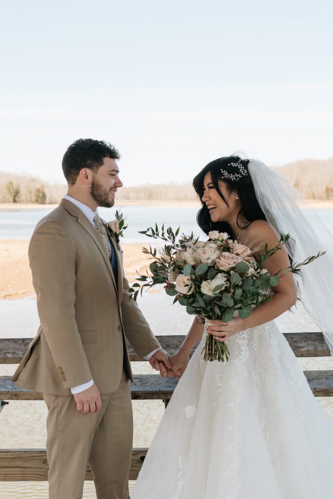 candid moment of couple laughing at long hunter state park in nashville