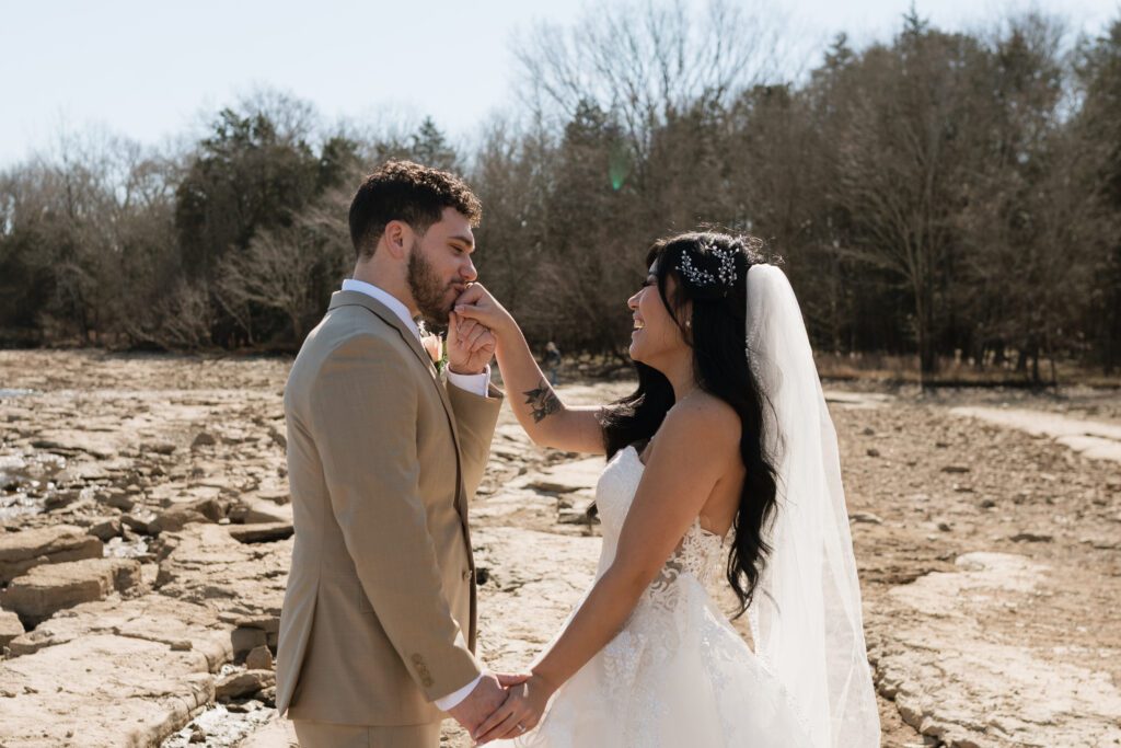 couple sharing a candid moment on the rocks at long hunter state park