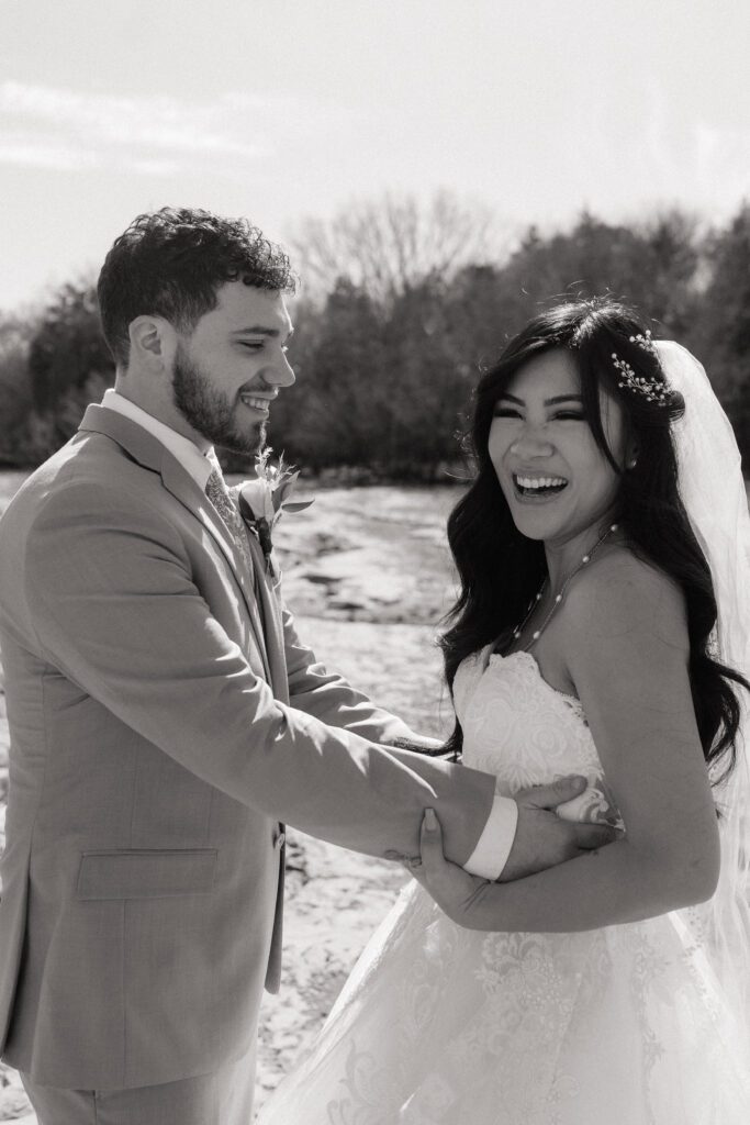 bride and groom laughing on their wedding day in nashville