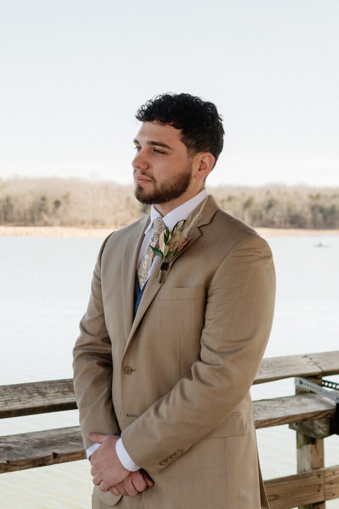 groom looking at his bride during their vows on their elopement day