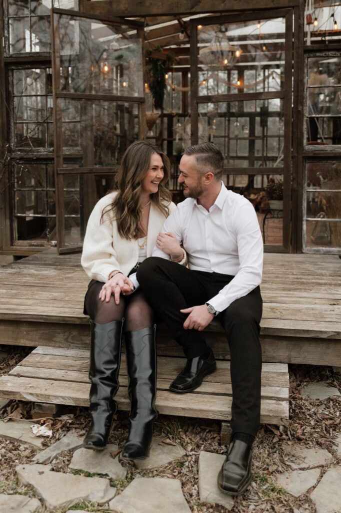 couple sitting and laughing during engagement session