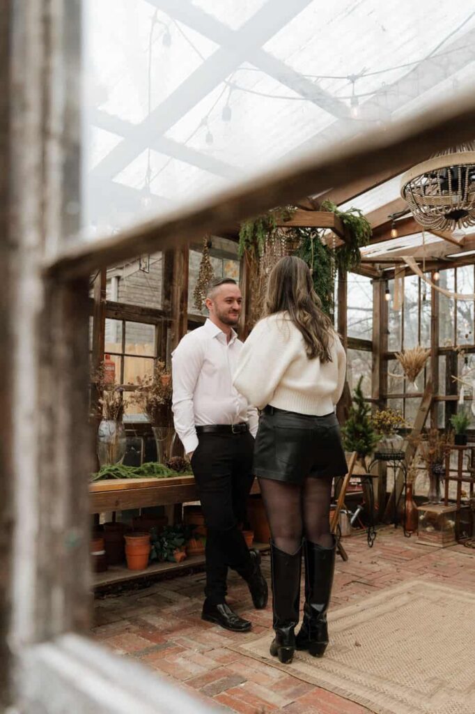 Romantic greenhouse engagement portraits