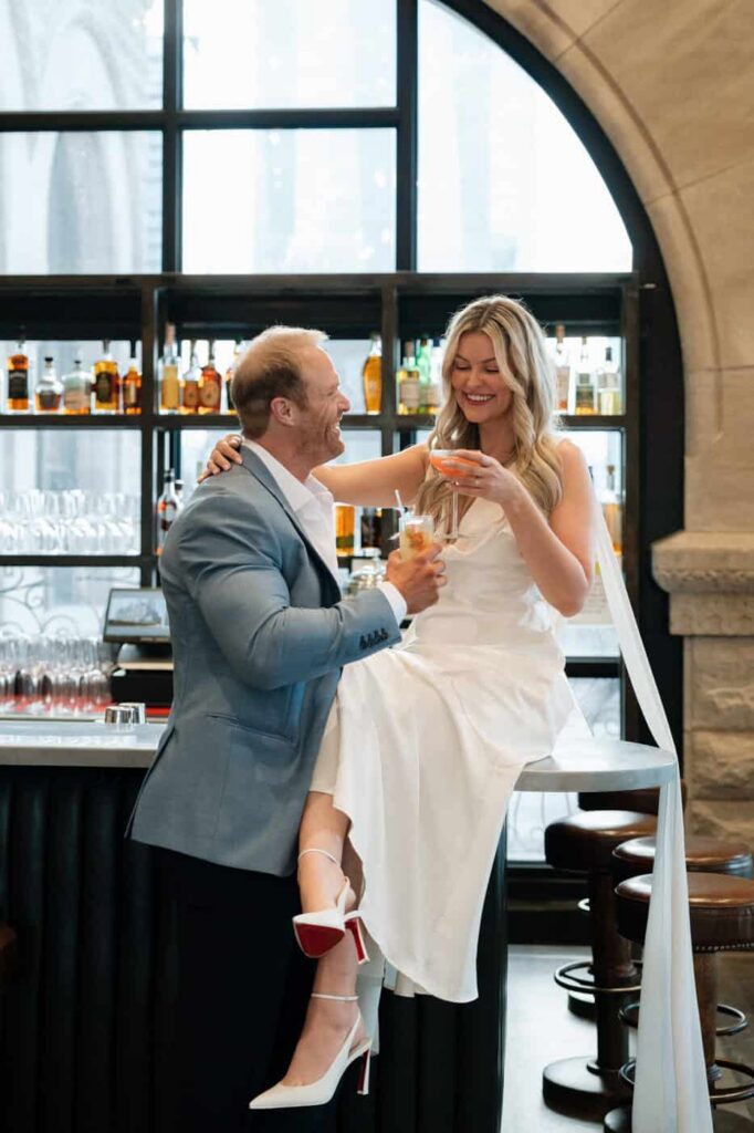 couple sharing a cocktail at the bar in union station hotel