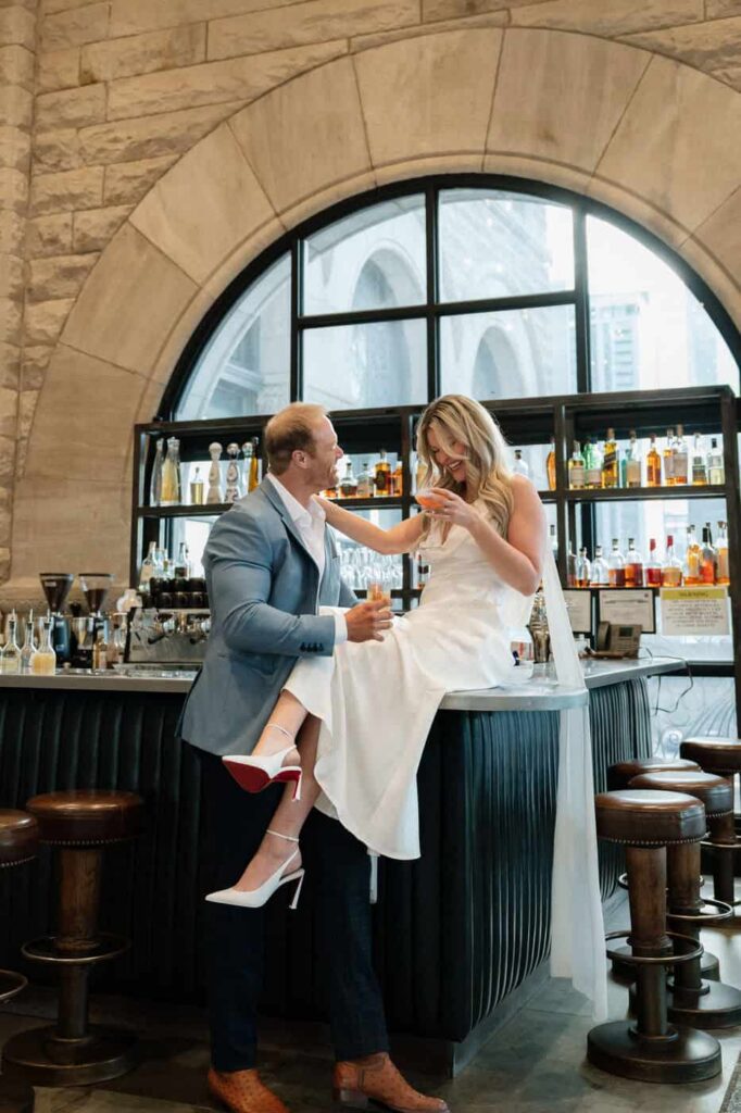 couple sharing laughs and cocktails at union station bar