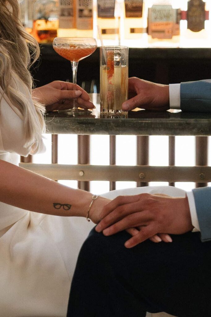 close up shot of couples hands at the bar during engagement session