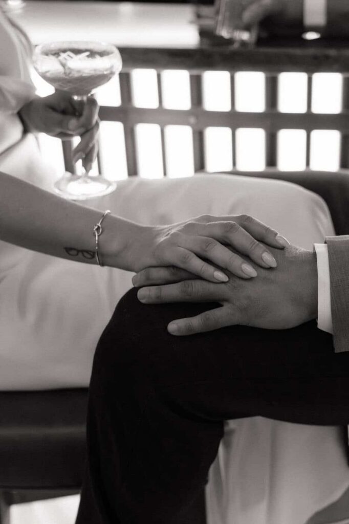 close up of couple holding hands during engagement portraits