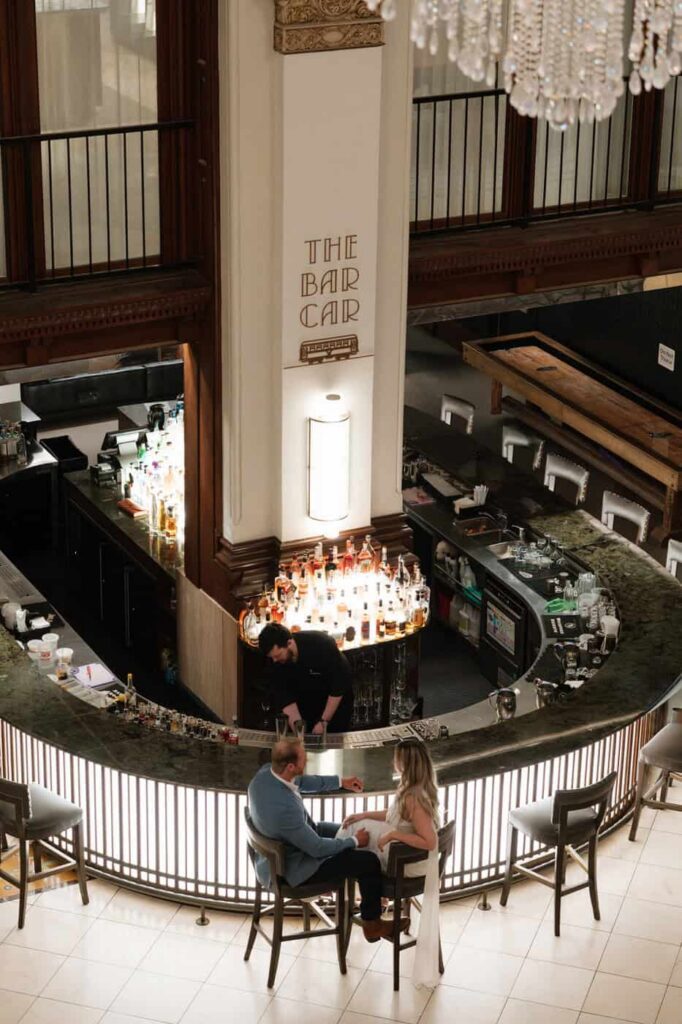 far away view of couple having drinks at union station bar in nashville