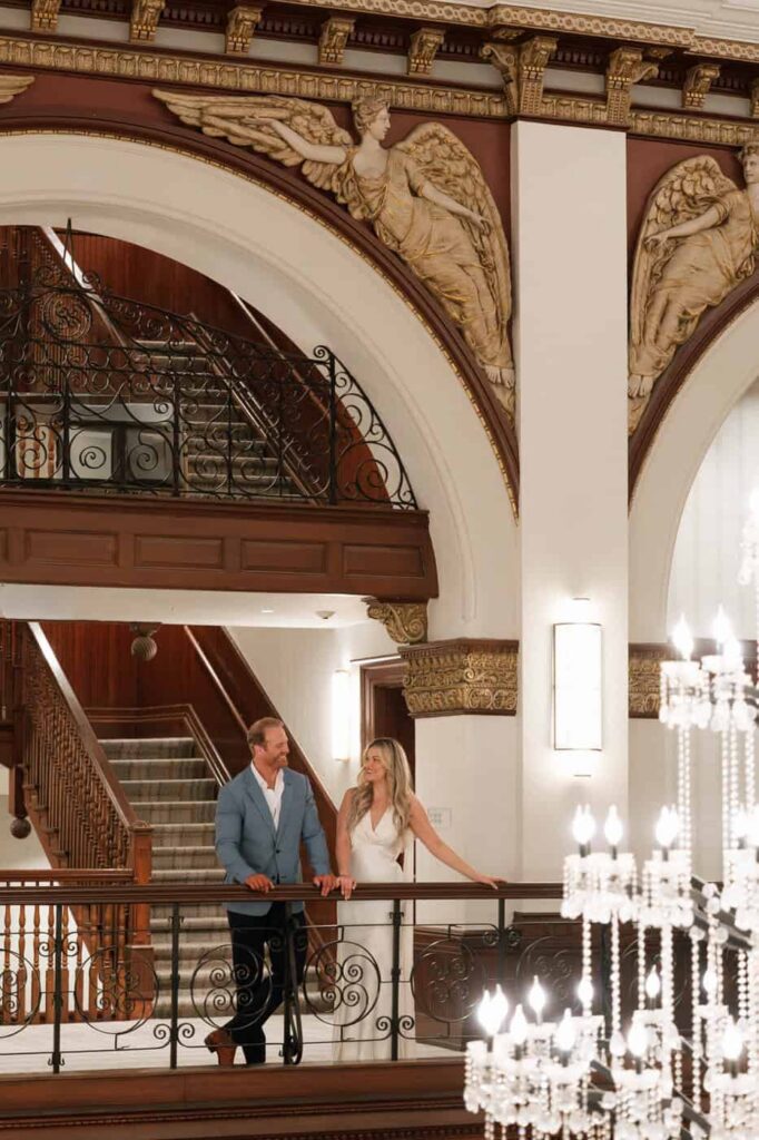 couple sharing a candid moment in the hotel lobby during engagement pictures