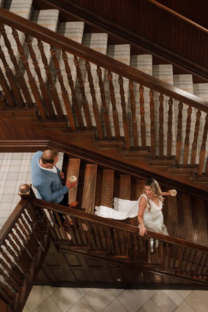 Couple sharing cocktails during Union Station engagement session in Nashville