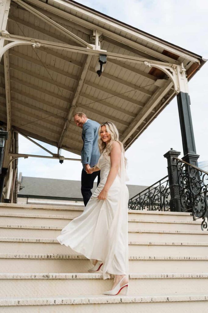 couple walking up the stairs at union station during engagement session