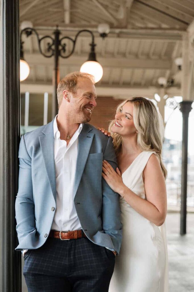 engaged couple sharing a sweet moment outside union station hotel in nashville