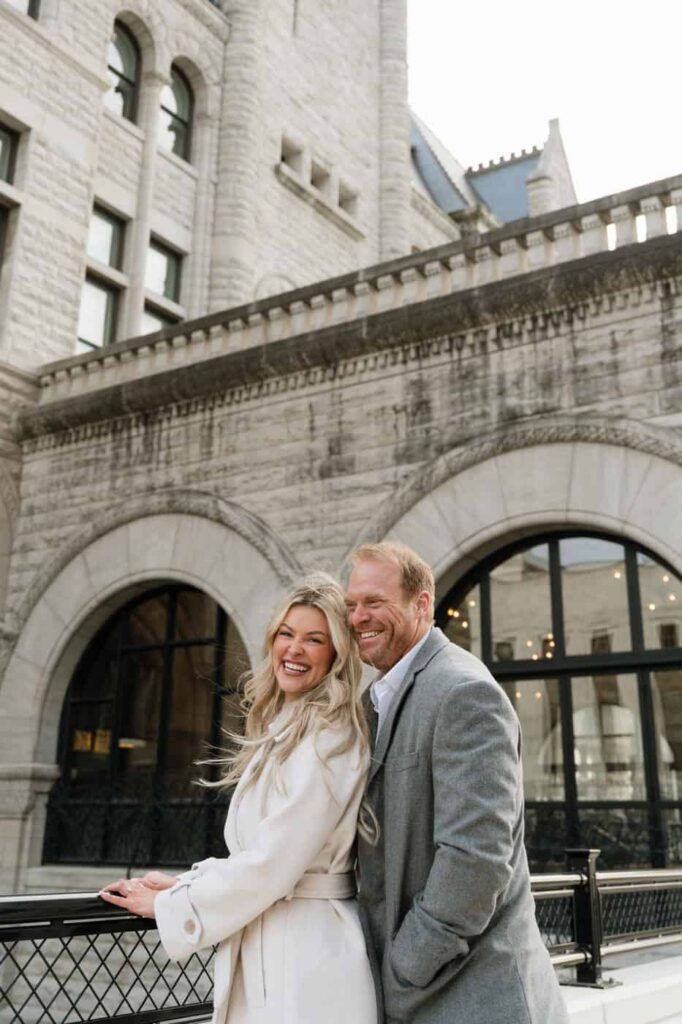 couple laughing during engagement pictures in downtown nashville