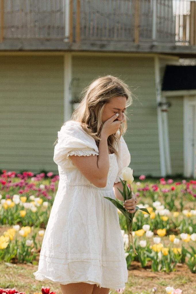 girl crying tears of joy after getting proposed to at tulip farm in nashville