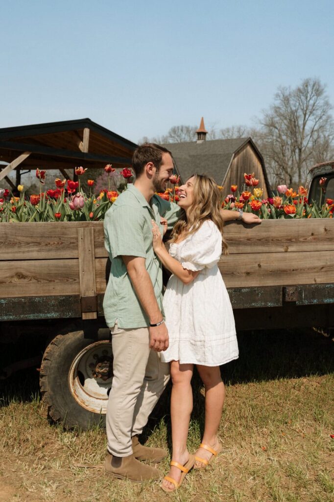 couple standing in front of flower truck at nashville engagement session