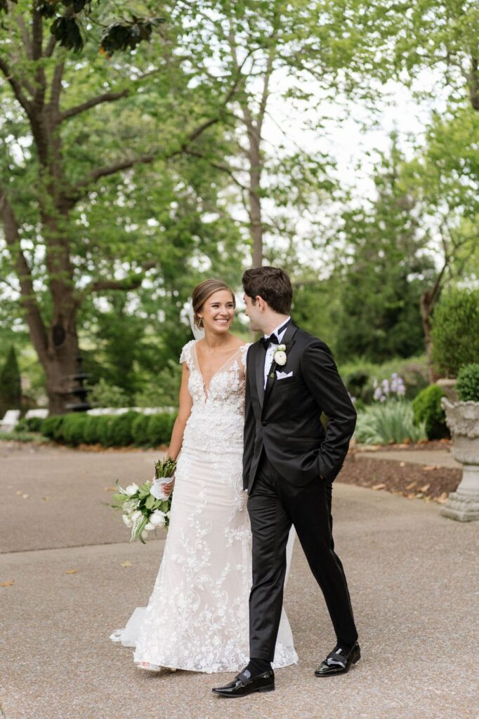 couple walking the grounds at riverwood mansion in nashville