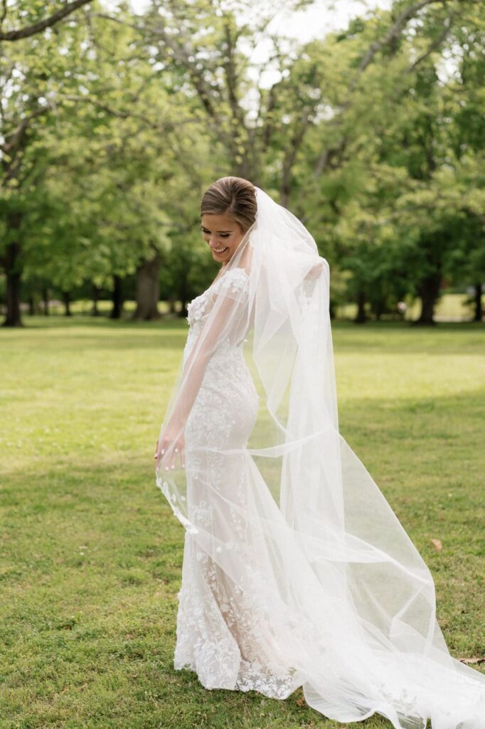 bride posing on the lawn at riverwood mansion in nashville